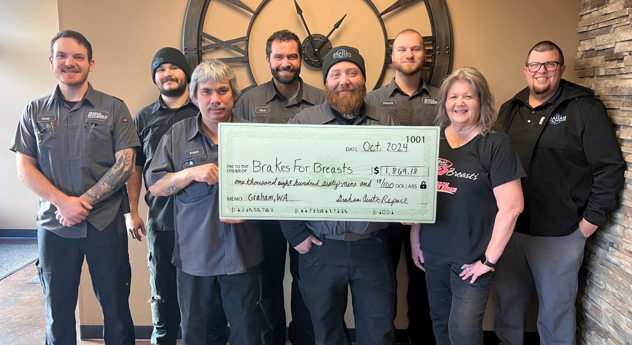 Brakes for Breasts in Graham, WA - Our Graham Auto Repair Team holding the donation check in 2024